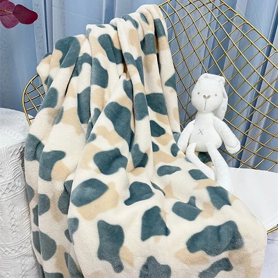 Couverture de corail à imprimé vache