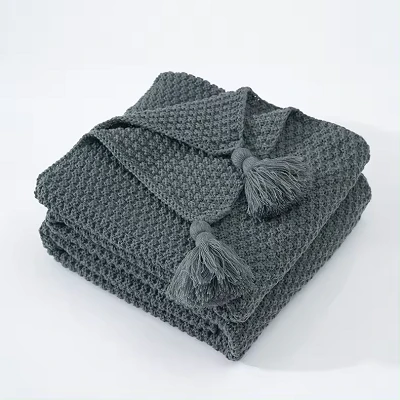 Couverture de gland en tricoté de couleur unie